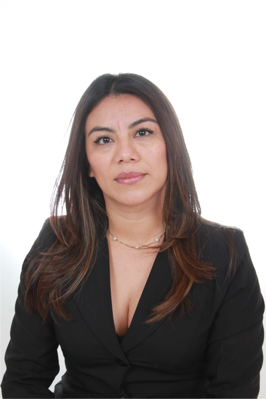 Maritza Recinos smiling in a red plaid shirt and tortoise shell glasses